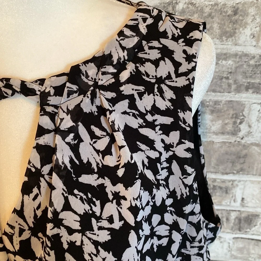 Karin Steven’s sleeveless black/white patterned lined dress. Tie at neck & waist